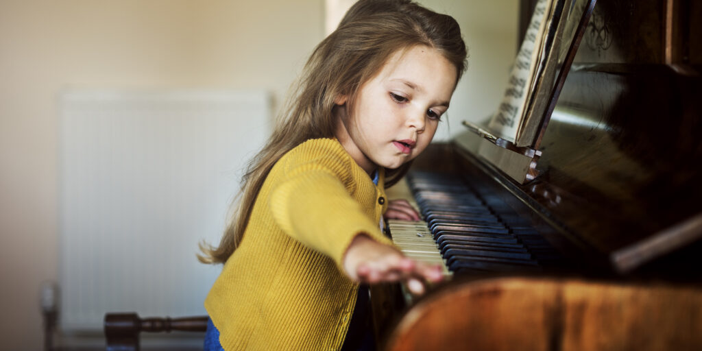 Girl Playing Piano Concept